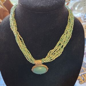 Chic Multi-Strand Green Necklace with Gold Pendant